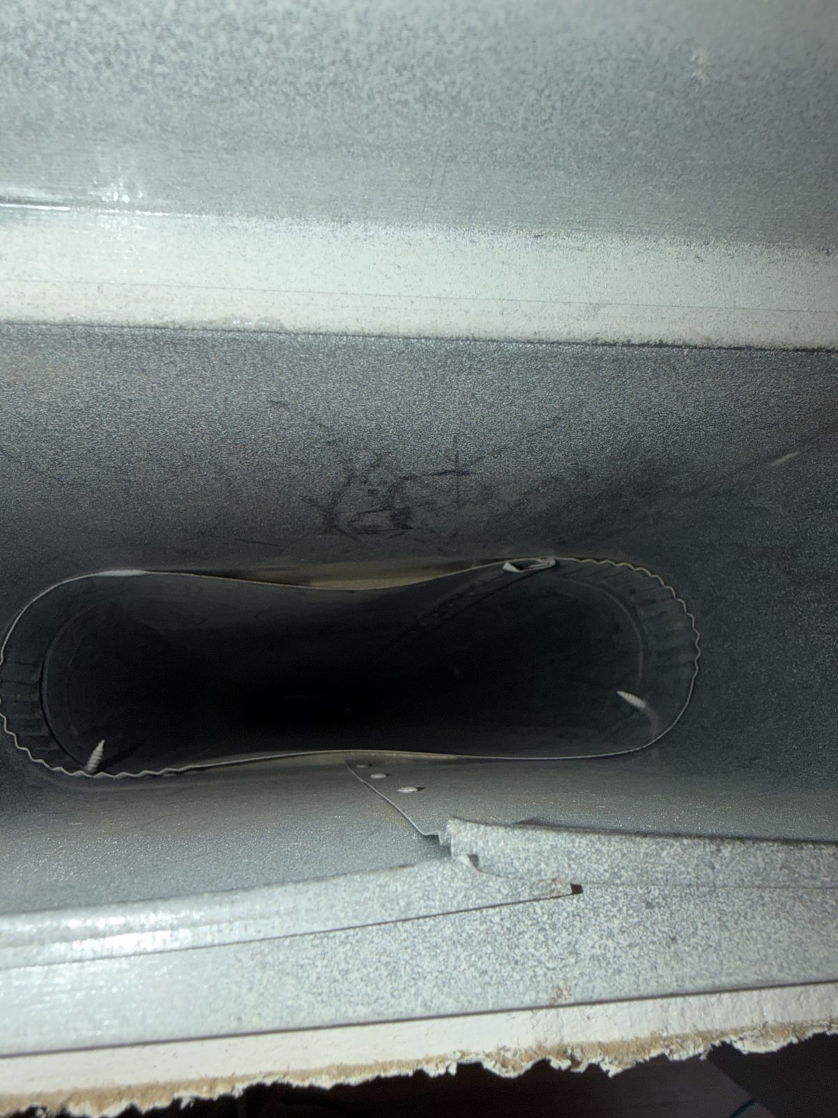 The same duct and takeoff after cleaning, down to bare galvanized metal
